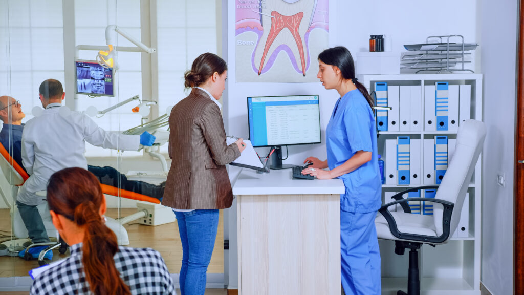 Young lady asking informations filling in stomatological form